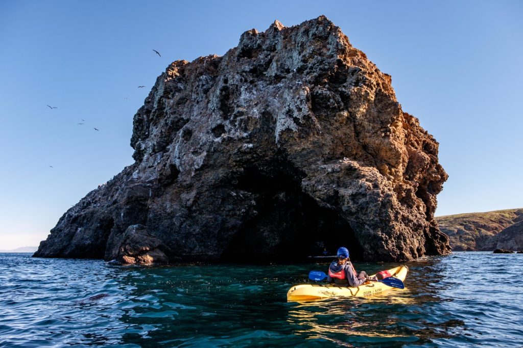 A kayaker near Scorpion Rock at Santa Cruz Island.